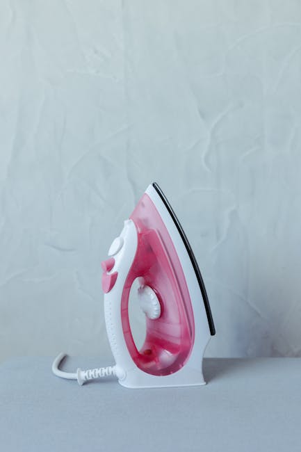 Garintu lygintuvu per popierių šalinama vaško dėmė nuo audinio, vaškas įsigeria į popierių